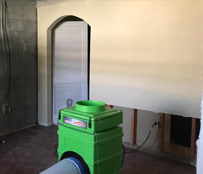 duct connected to air scrubber removed lower wall and poly covering ceiling