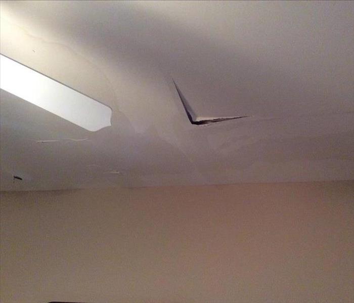 water damage in ceiling, split at seam