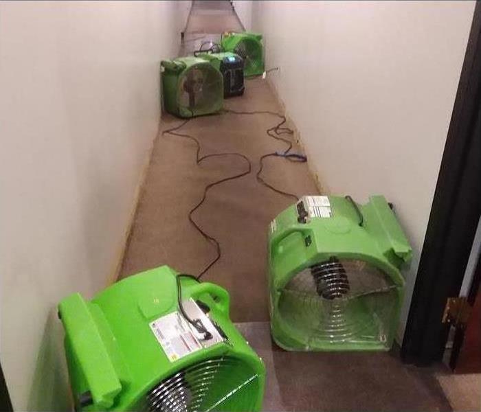 green axial fans in a narrow corridor